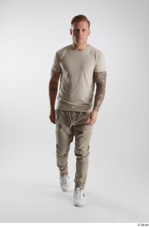 Gilbert 1 dressed front view grey t-shirt grey trousers walking…